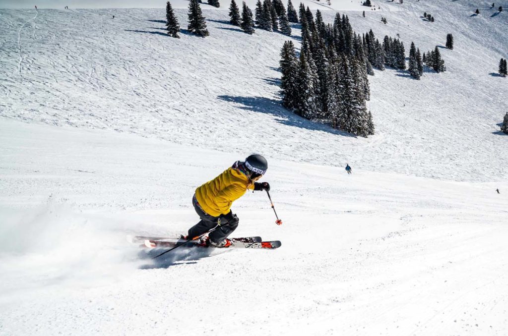 Skier riding down the snow covered terrain in Chelan