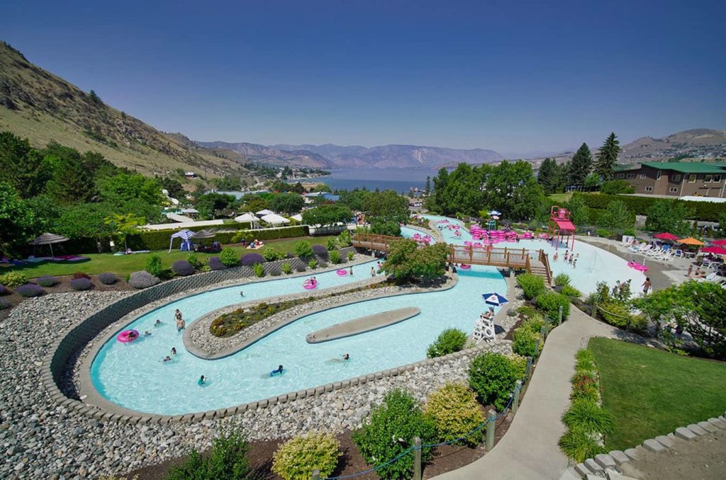 Family friendly lazy river at a water park with Lake Chelan in the background