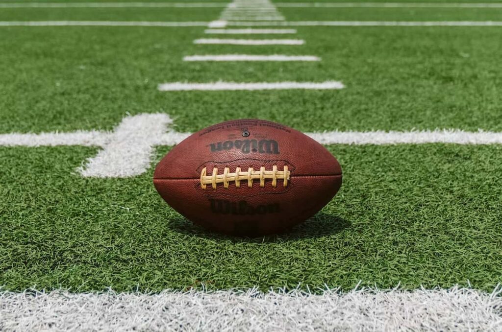 Football laying on a field